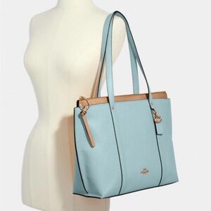 Light blue coach bag.